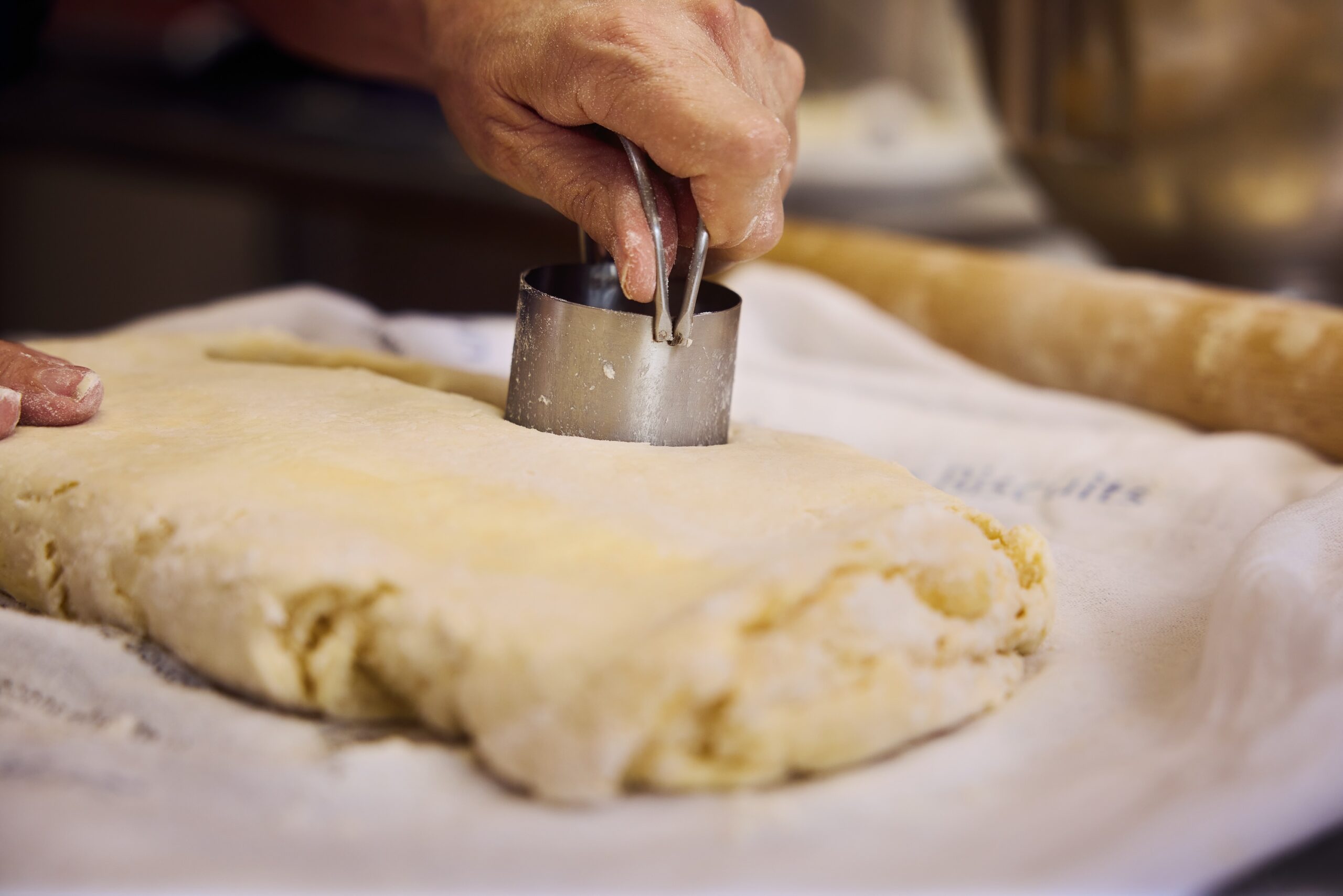Chef Charbonneau cutting biscuit dough